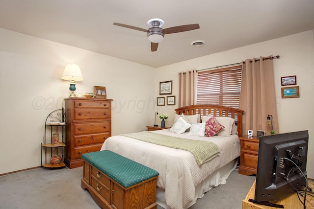 8219 Lamount Dr, Amarillo, TX 79110 - bedroom with light carpet and ceiling fan