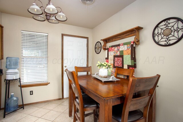 8219 Lamount Dr, Amarillo, TX 79110 - dining room featuring a chandelier and light tile patterned floors