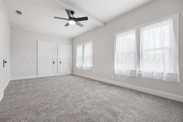 unfurnished bedroom featuring beamed ceiling, ceiling fan, and carpet flooring