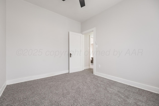 spare room featuring carpet flooring and ceiling fan