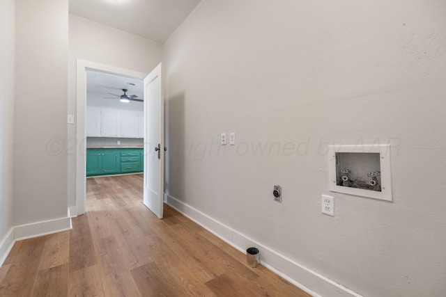 washroom with light wood-type flooring, hookup for a washing machine, and electric dryer hookup