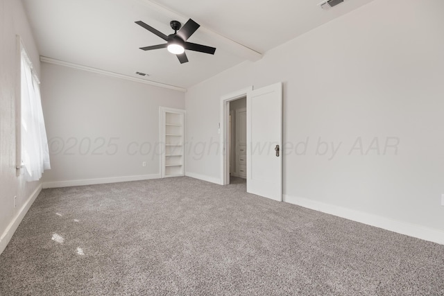 unfurnished bedroom with ornamental molding, carpet, and ceiling fan