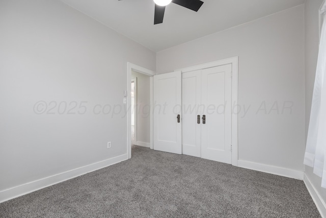 unfurnished bedroom with ceiling fan, carpet flooring, and a closet