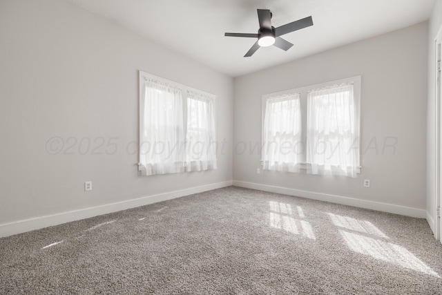 spare room featuring carpet floors and ceiling fan