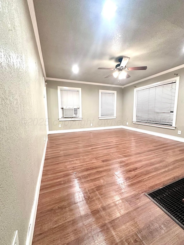 1214 S Alabama St, Amarillo, TX 79102 - unfurnished room with a textured wall, crown molding, wood finished floors, a ceiling fan, and cooling unit