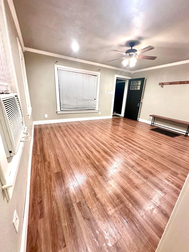 1214 S Alabama St, Amarillo, TX 79102 - unfurnished living room with crown molding, wood finished floors, and ceiling fan