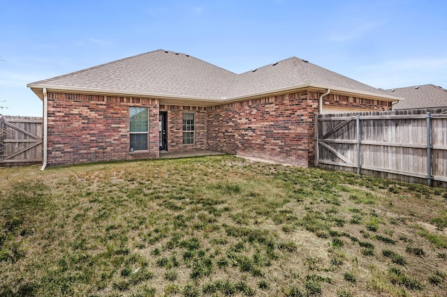 7901 Crestline Dr, Amarillo, TX 79119 - rear view of house with brick siding, a shingled roof, and a patio
