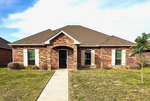 7901 Crestline Dr, Amarillo, TX 79119 - view of front of home with roof with shingles, a front lawn, and brick siding