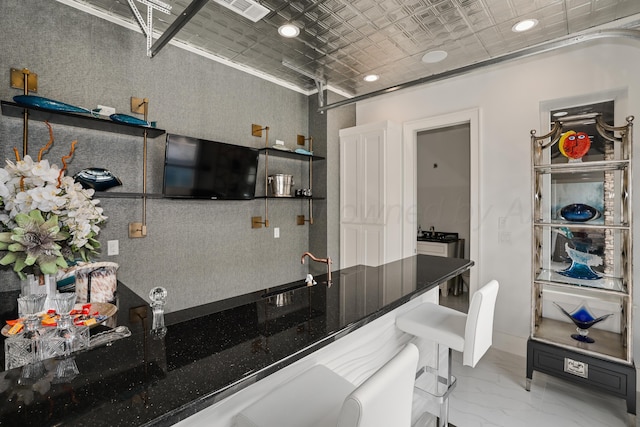 kitchen with visible vents, a sink, an ornate ceiling, marble finish floor, and recessed lighting