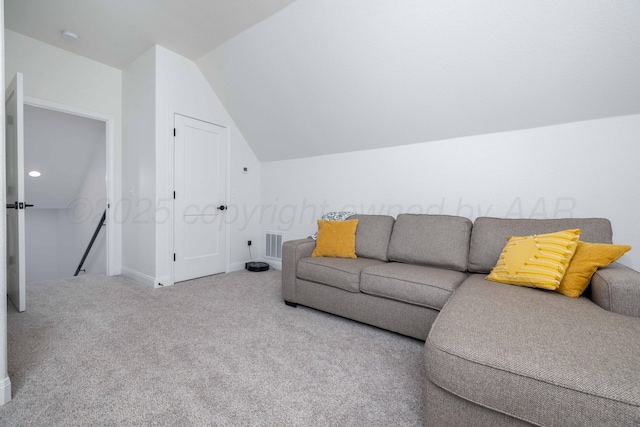carpeted living area featuring vaulted ceiling, visible vents, and baseboards