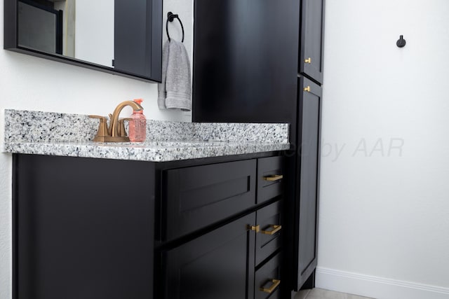 interior details with baseboards and a sink