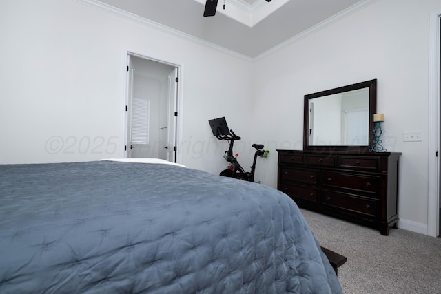 carpeted bedroom featuring ceiling fan, baseboards, and ornamental molding