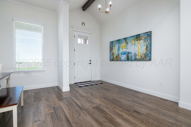 foyer entrance with a chandelier, dark wood finished floors, vaulted ceiling with beams, and baseboards