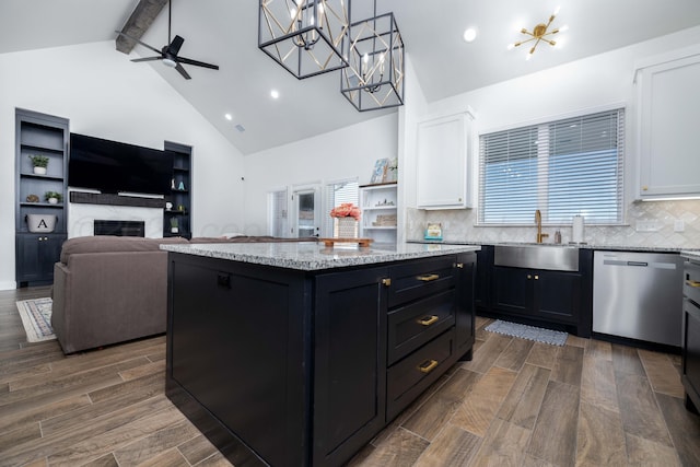 kitchen with dishwasher, white cabinetry, a sink, and dark cabinetry