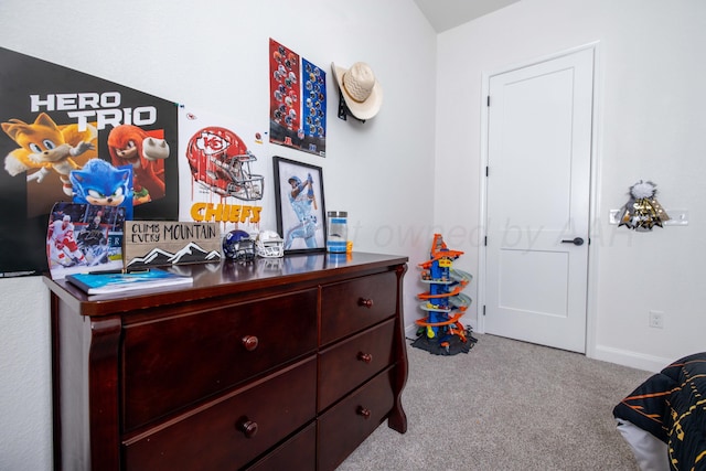 carpeted bedroom featuring baseboards