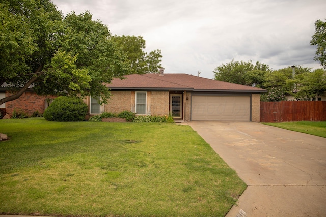 1403 Charles Ave, Panhandle, TX 79068 - ranch-style house with concrete driveway, an attached garage, and brick siding