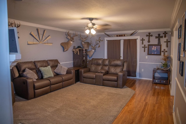 1403 Charles Ave, Panhandle, TX 79068 - living room with a ceiling fan, crown molding, and light wood-style floors