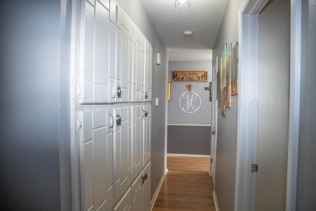 1403 Charles Ave, Panhandle, TX 79068 - corridor featuring baseboards and dark wood-style floors