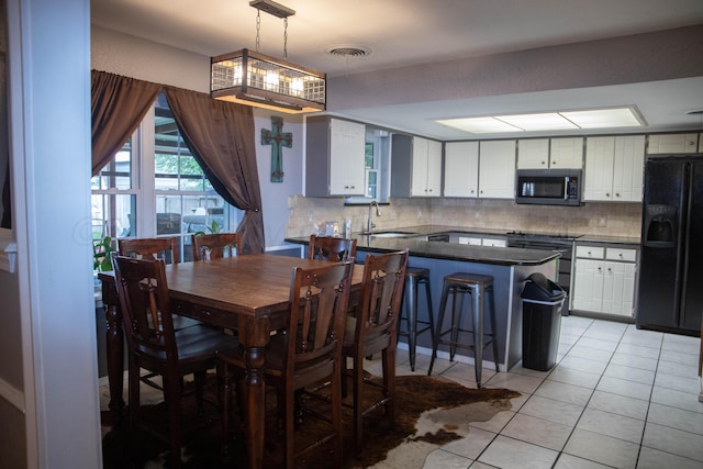 1403 Charles Ave, Panhandle, TX 79068 - dining space with light tile patterned floors