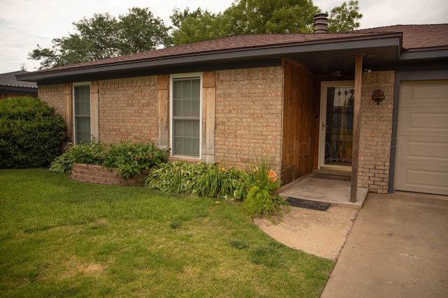 1403 Charles Ave, Panhandle, TX 79068 - doorway to property featuring a lawn, brick siding, and roof with shingles