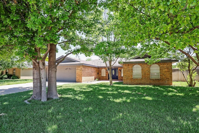 3519 Rutson Dr, Amarillo, TX 79109 - ranch-style house with brick siding, a garage, and concrete driveway