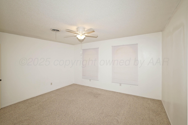 3519 Rutson Dr, Amarillo, TX 79109 - unfurnished room featuring carpet floors, ceiling fan, and a textured ceiling