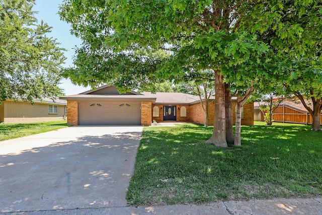 3519 Rutson Dr, Amarillo, TX 79109 - view of front facade with a garage, concrete driveway, and brick siding