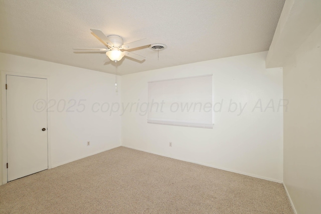 3519 Rutson Dr, Amarillo, TX 79109 - spare room with carpet floors, ceiling fan, baseboards, and a textured ceiling