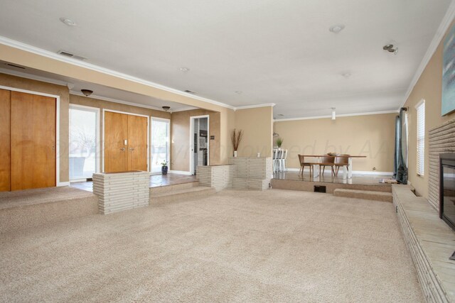 5506 Everett Ave, Amarillo, TX 79106 - unfurnished living room with carpet flooring, healthy amount of natural light, crown molding, and a glass covered fireplace