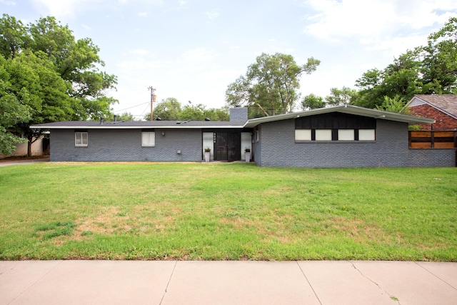 5506 Everett Ave, Amarillo, TX 79106 - view of front of property with brick siding, a chimney, and a front yard