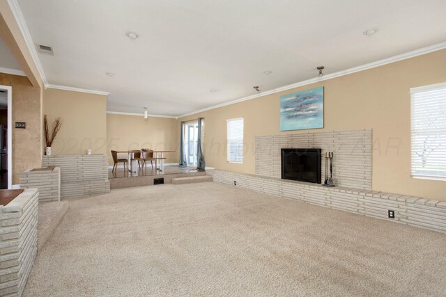 5506 Everett Ave, Amarillo, TX 79106 - unfurnished living room featuring carpet, crown molding, and a brick fireplace