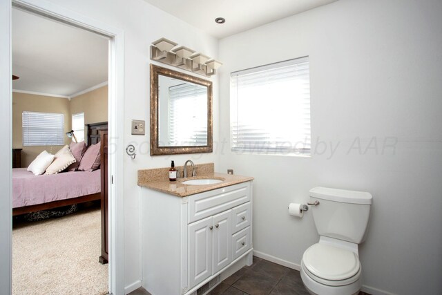 5506 Everett Ave, Amarillo, TX 79106 - bathroom featuring vanity, ensuite bathroom, and ornamental molding