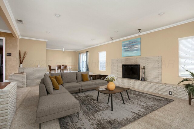 5506 Everett Ave, Amarillo, TX 79106 - carpeted living room featuring a brick fireplace and crown molding