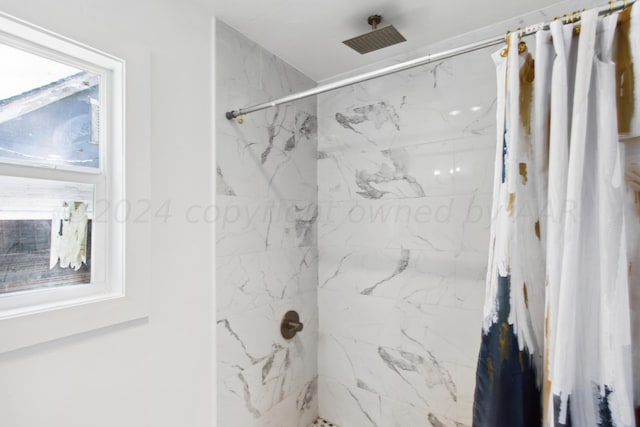 bathroom featuring a shower with curtain