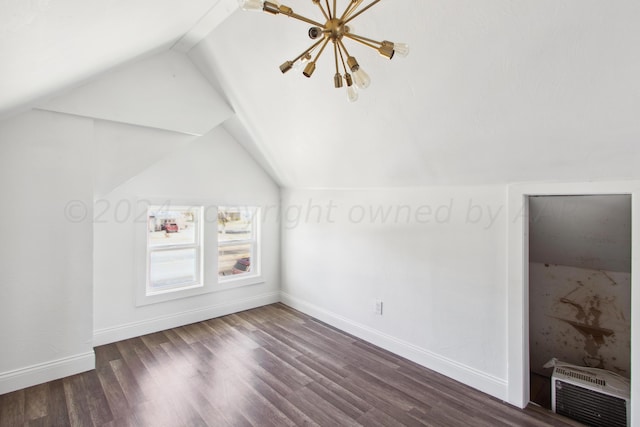 bonus room with vaulted ceiling and dark hardwood / wood-style floors