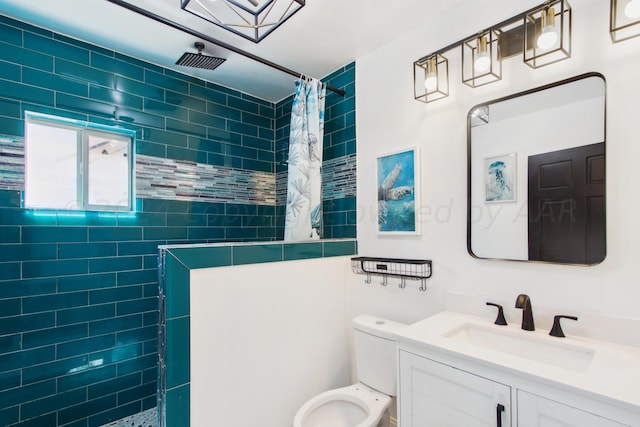 bathroom with a shower with shower curtain, vanity, and toilet