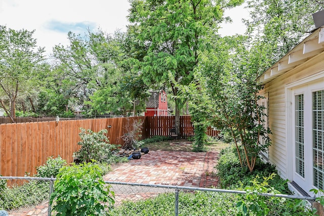 fenced backyard featuring a patio area