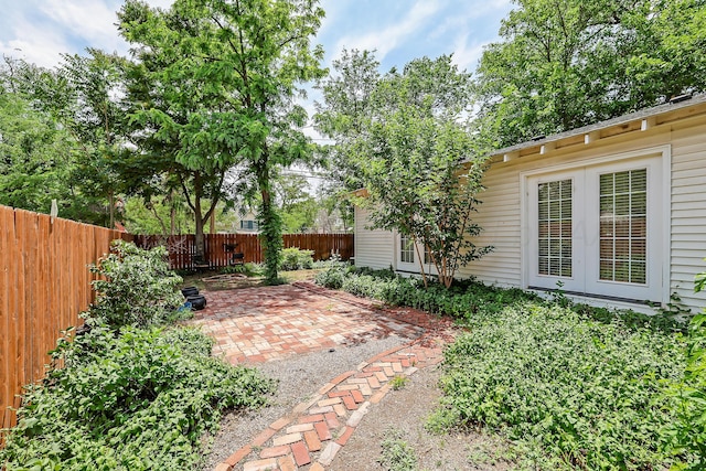 fenced backyard featuring a patio area