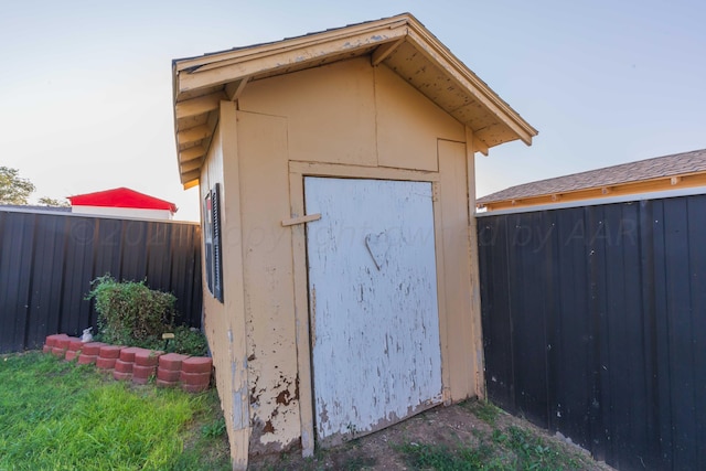 view of shed featuring a fenced backyard