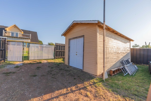 view of shed with a fenced backyard