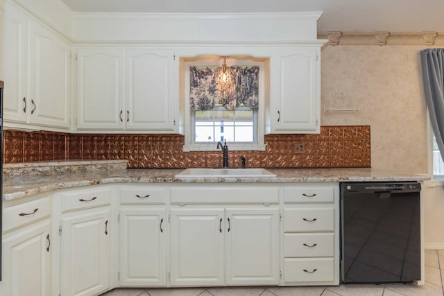 kitchen featuring dishwasher, light stone counters, a sink, and light tile patterned floors