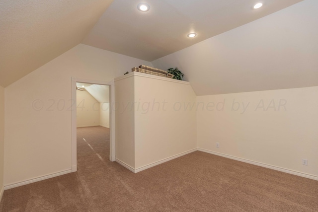 bonus room featuring lofted ceiling, baseboards, carpet floors, and recessed lighting