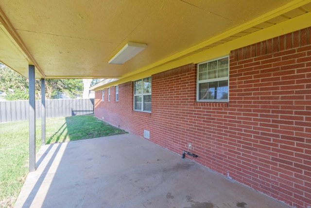 view of patio featuring fence
