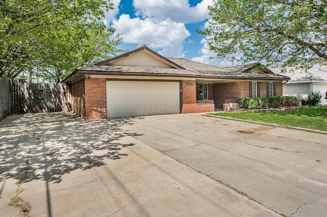 7216 Gainsborough Rd, Amarillo, TX 79106 - ranch-style home featuring brick siding, an attached garage, and concrete driveway