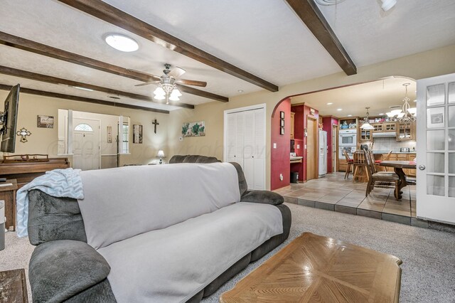 7216 Gainsborough Rd, Amarillo, TX 79106 - carpeted living area with a ceiling fan, beamed ceiling, recessed lighting, and arched walkways