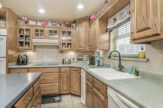 7216 Gainsborough Rd, Amarillo, TX 79106 - kitchen with a sink, under cabinet range hood, white appliances, tasteful backsplash, and light tile patterned floors