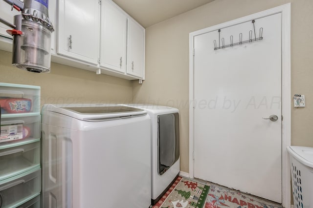 7216 Gainsborough Rd, Amarillo, TX 79106 - clothes washing area featuring cabinet space and washing machine and dryer