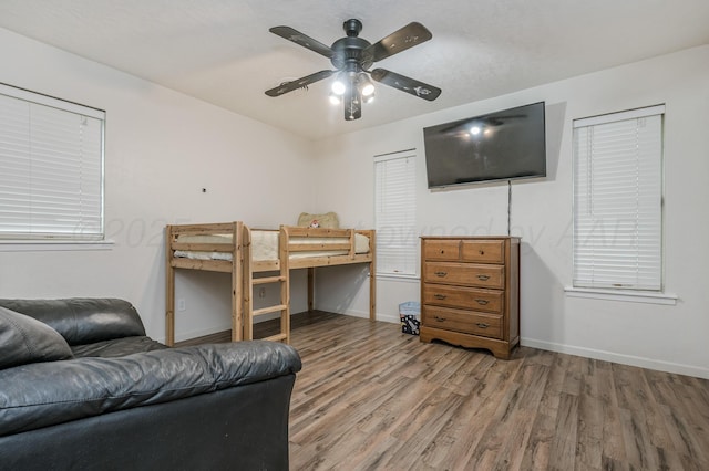 7216 Gainsborough Rd, Amarillo, TX 79106 - bedroom featuring wood finished floors, baseboards, and ceiling fan