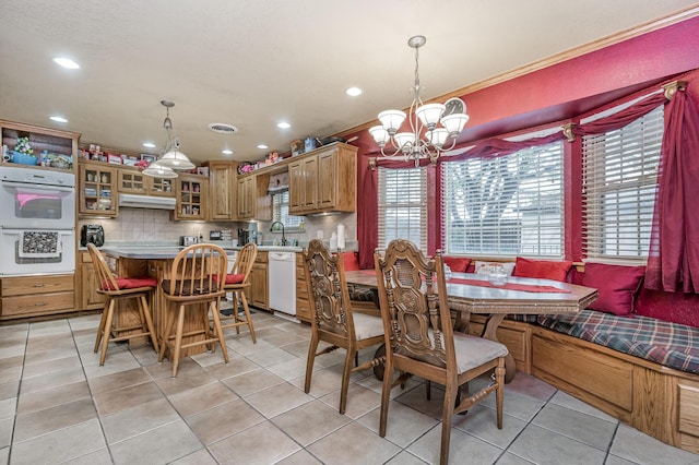 7216 Gainsborough Rd, Amarillo, TX 79106 - dining space with a chandelier, light tile patterned flooring, and recessed lighting
