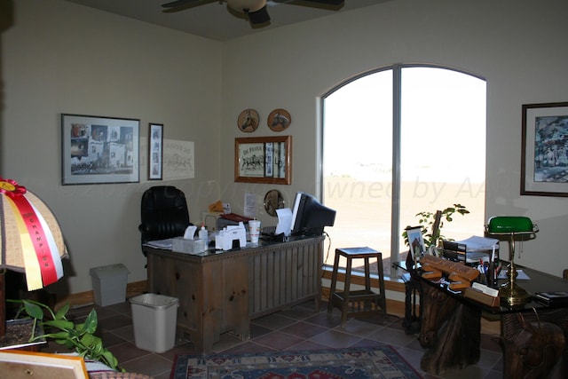 tiled office space with ceiling fan